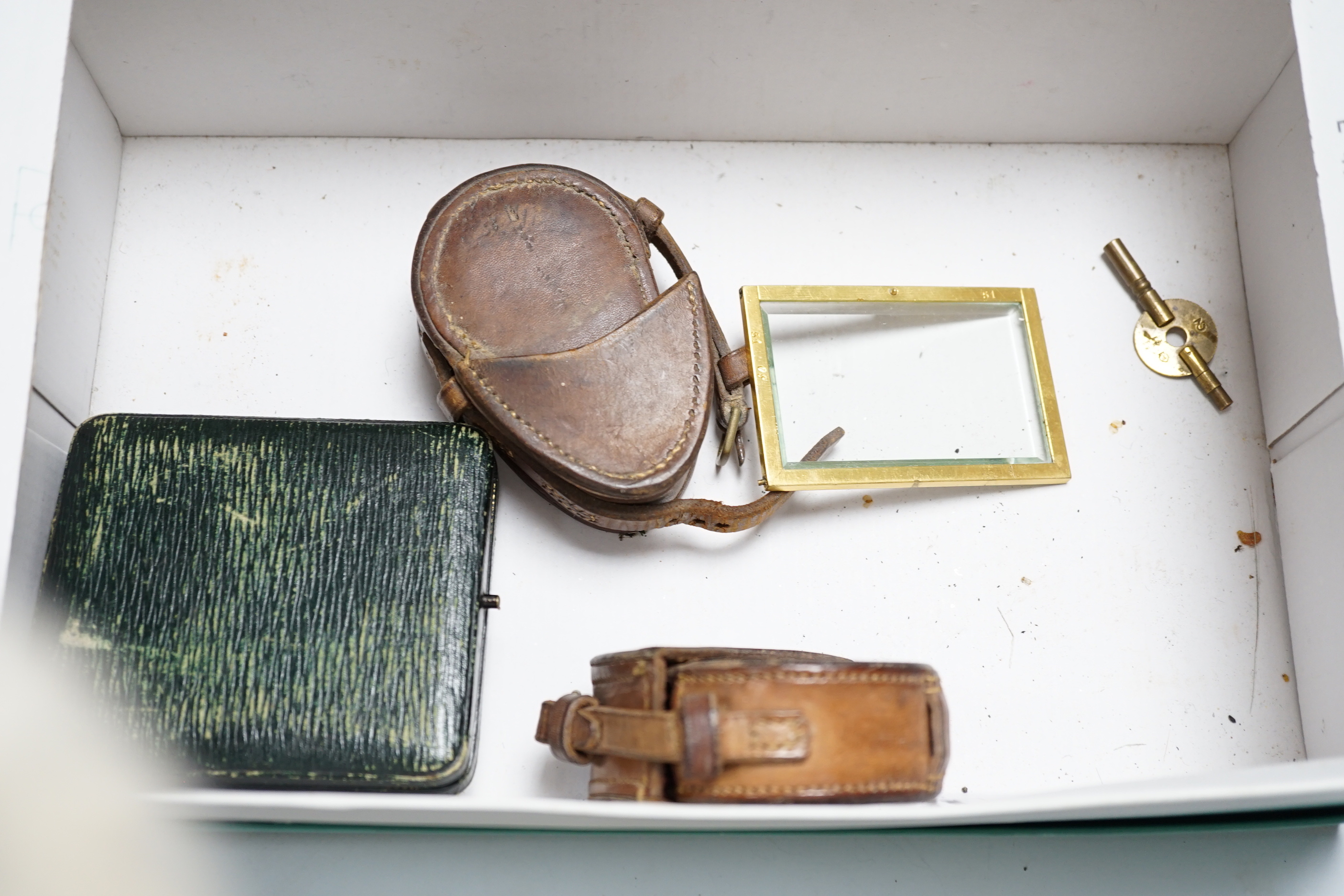 An Asprey pocket watch in silver mounted case, brass cased carriage timepiece, military compasses etc.